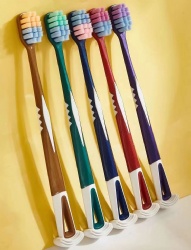 Toothbrush with tongue cleaner